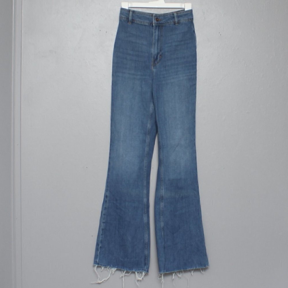 Free People high rise flare raw hem medium wash jeans